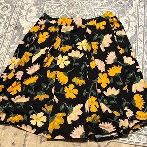 LuLaRoe Black Skirt with Yellow and Cream Floral. Size medium. Below the knee.